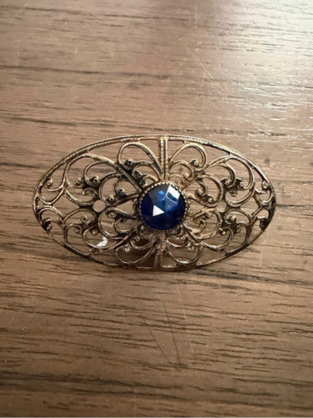 Antique-Style Filigree Brooch with Blue Center Stone